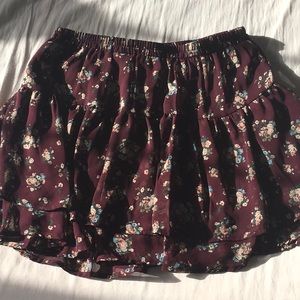 Maroon skirt with blue, white, and pink flowers